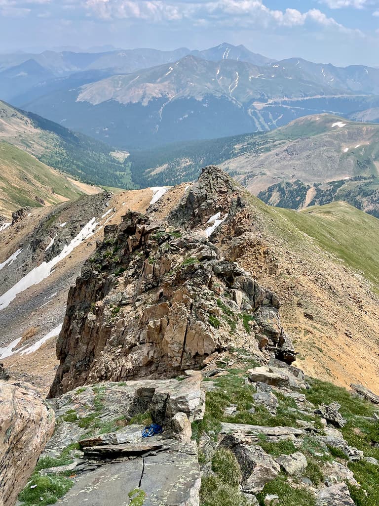 Blue rope and an anchor is visible closer to the bottom of this photo, the chute I've just climbed to the right. Grays and Torreys on the horizon.